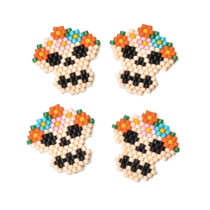 Handmade MIYUKI seed bead skull charms with colorful floral crowns in a 4-piece set