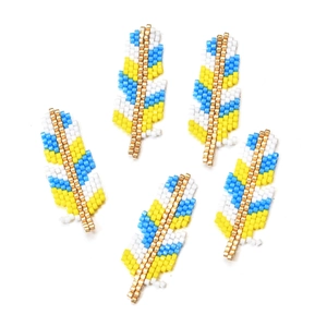 Detail of five handmade MIYUKI glass seed bead feather pendants for DIY jewelry making