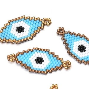 Handmade Miyuki bead charm featuring a Greek evil eye design for DIY jewelry making