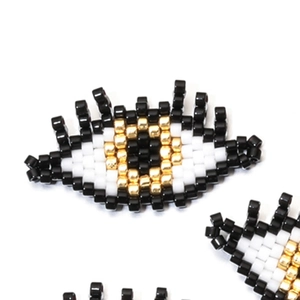 Handmade Miyuki seed bead Evil Eye charm in black, white, and gold for jewelry making