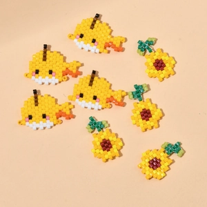 DIY handmade pixel art beads in cute whale and sunflower shapes for jewelry making