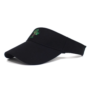 Close-up of coconut tree embroidery on black cotton sun visor hat for outdoor activities