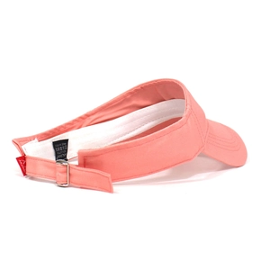 Detail view of pink cotton sun visor showing the adjustable silver metal buckle and tag