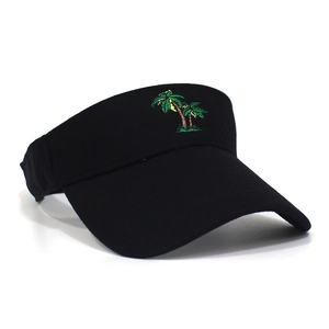 Detail of colorful palm tree embroidery on a black cotton sun visor for summer sports