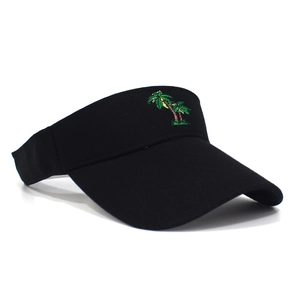 Detail of green coconut tree embroidery on a black cotton sun visor hat for summer