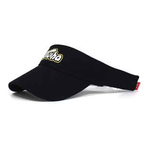 Close-up of black cotton sun visor featuring premium 3D letter embroidery and curved brim