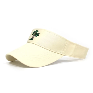 Close-up of coconut tree embroidery on a cream cotton sun visor for outdoor sports