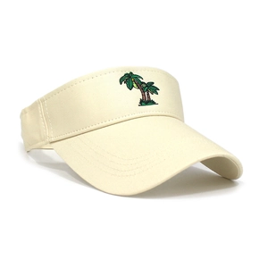 Detail of coconut tree embroidery on a beige cotton sun visor for summer outdoor sports