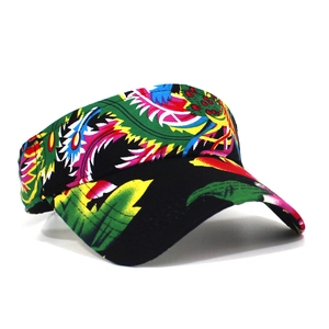 Detail view of the colorful tropical floral print on a black sun visor sports hat
