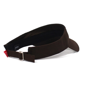 Detail of deep brown cotton visor with adjustable strap and metal buckle for sun protection