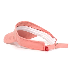Détail de la visière rose montrant la bande anti-transpirante et la boucle réglable