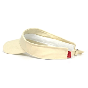 Detail of adjustable metal buckle and red brand tag on a beige cotton sun visor hat
