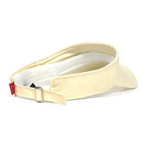 Detail of adjustable metal buckle and embroidered label on beige cotton sun visor hat
