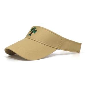 Detail of khaki cotton sun visor featuring precise palm tree embroidery and reinforced stitching