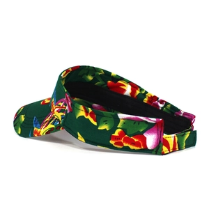 Detail of floral sun visor featuring tropical print, inner sweatband and velcro strap