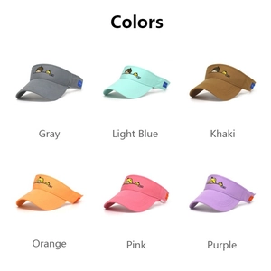 Detail view of multi-color cotton sun visors with cartoon embroidery in six vibrant shades