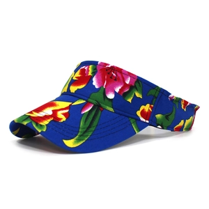 Detail of blue floral sun visor hat with tropical print and reinforced brim stitching