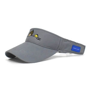 Detail view of grey sun visor hat with cartoon embroidery and reinforced brim stitching