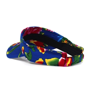 Detail of tropical floral sun visor with adjustable velcro strap and black sweatband