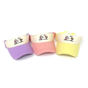 Close-up showing colorful sun visors with cartoon girl embroidery and neat stitching details