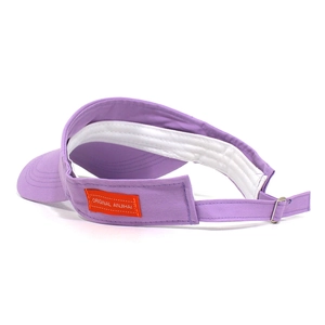 Close-up of lavender cotton sun visor with orange woven label and adjustable metal buckle