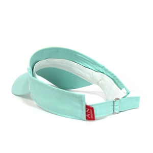 Detail view of adjustable metal buckle and thick sweatband on mint green sun hat