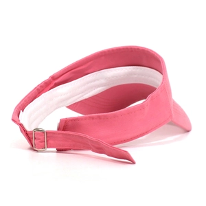 Detail of pink cotton sun visor showing the inner sweatband and adjustable metal buckle