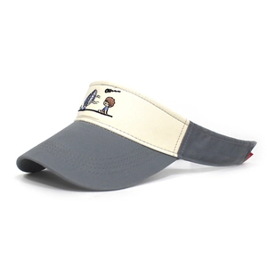 Detail of grey and beige cotton sun visor with cartoon boy embroidery and Oh text