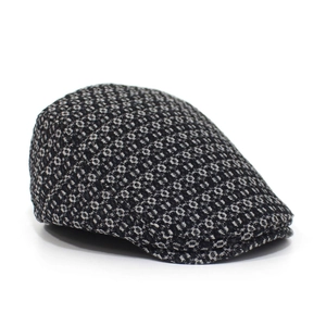 Detail view of cotton jacquard denim flat cap with classic black and white weave texture