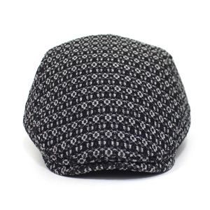 Detailed macro view of black and white jacquard denim fabric texture on flat cap