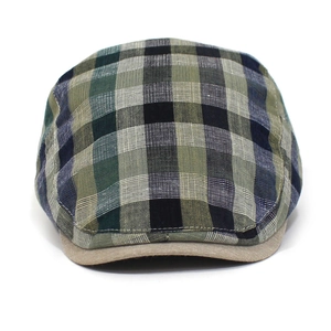 Detail view of classic plaid ivy cap showing breathable cotton blend texture and visor