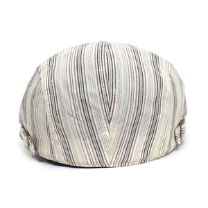 Detail view of cotton striped flat cap with side adjustable bronze metal buckle