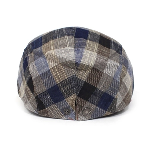 Rear view of plaid cotton flat cap with blue and grey vintage patterns and metal snap detail