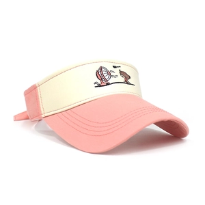 Detail of pink and beige cotton sun visor hat with cute girl and fan embroidery