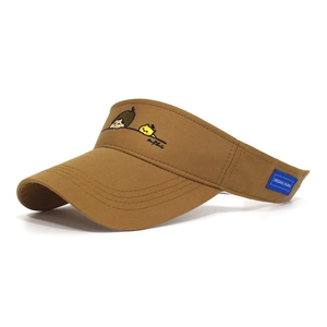 Detail of a brown cotton sun visor with cute cartoon embroidery and blue brand woven label