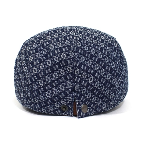 Blue denim jacquard beret hat for men featuring white woven textures and metal side buckles