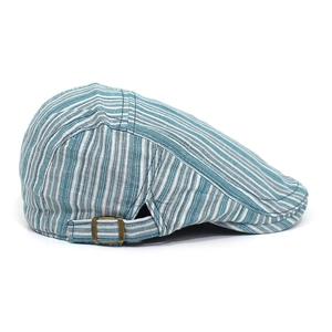 Detail shot of blue and green striped cotton ivy cap with vintage bronze metal side buckle