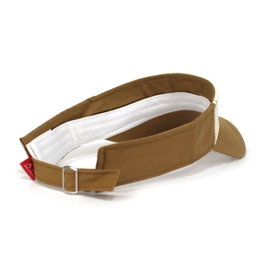 Detail view of cotton sun visor featuring adjustable metal buckle and thick white sweatband