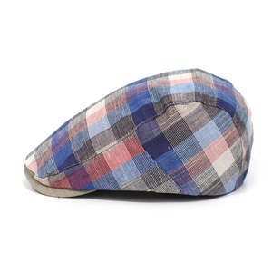 Side view of a vintage plaid flat cap featuring colorful red blue and grey checkered cotton