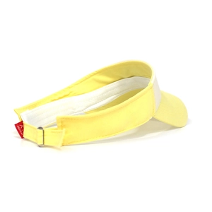 Detail view of yellow cotton sun visor with metal buckle and embroidered brand label