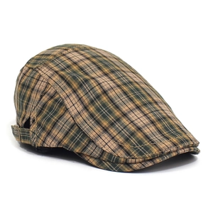Detail shot of vintage plaid flat cap featuring side metal adjustment buckle and classic texture