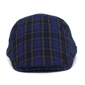 Detail of navy and black plaid pattern on a vintage British style flat cap fabric