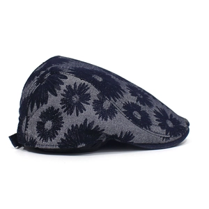 Detailed side view of navy blue cotton ivy cap with white daisy floral print