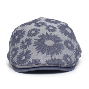Detail of floral daisy print on gray cotton fabric of the adjustable ivy driving cap