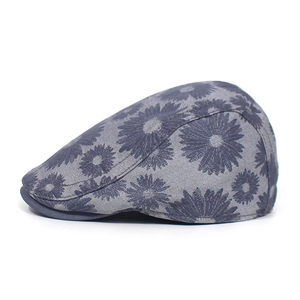 Close-up of the cotton floral beret featuring daisy prints and textured fabric details