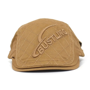 Detail of the 3D Bustling embroidery and diamond quilting on the brown cotton beret