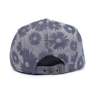 Detailed back view of a grey daisy print cotton cap with an adjustable metal buckle