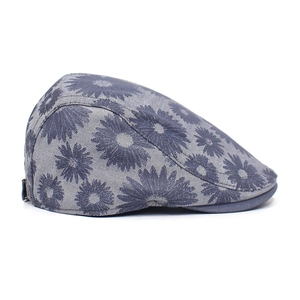 Close-up of vintage denim texture and blue daisy floral print with metal buckle adjust