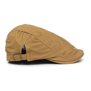Detail of khaki cotton flat cap featuring diamond quilting and metal buckle adjustment