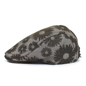 Close-up of floral cotton ivy cap showing daisy print and metal adjustment buckle detail